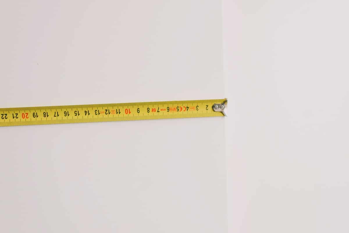metallic tape measure on wall